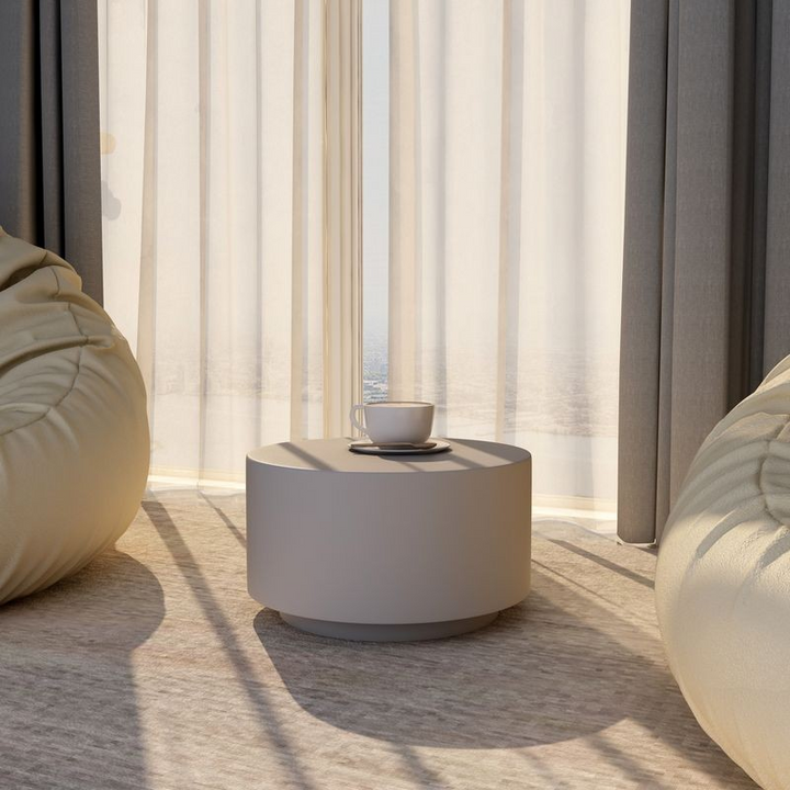 LeisureMod Terra Collection Fiberglass Outdoor Coffee Table in Grey in Room.