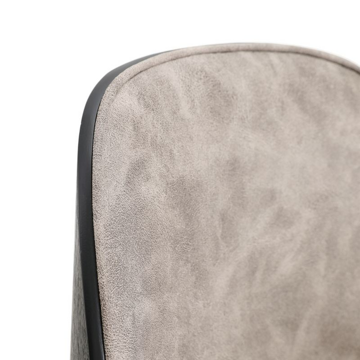 LeisureMod Tule 7-Piece Dining Set in Steel Frame with 6 Upholstered Seat Dining Chairs and 71" Oval Dining Table with MDF Tabletop Black/White Chair Closeup.