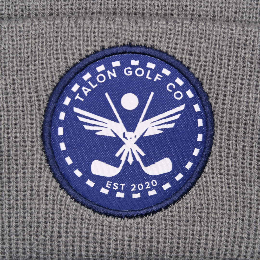 Gray Knit Beanie with Navy Eagle Circle Logo Closeup.