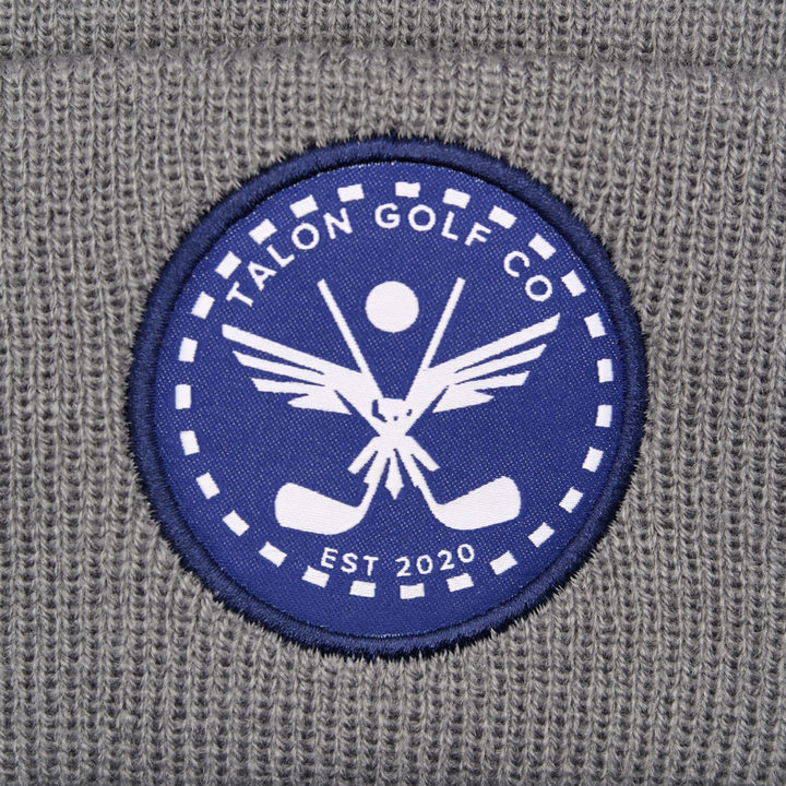 Gray Knit Beanie with Navy Eagle Circle Logo Closeup.