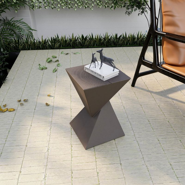 LeisureMod Glint Collection Fiberglass Outdoor Side Table in Grey on Patio.