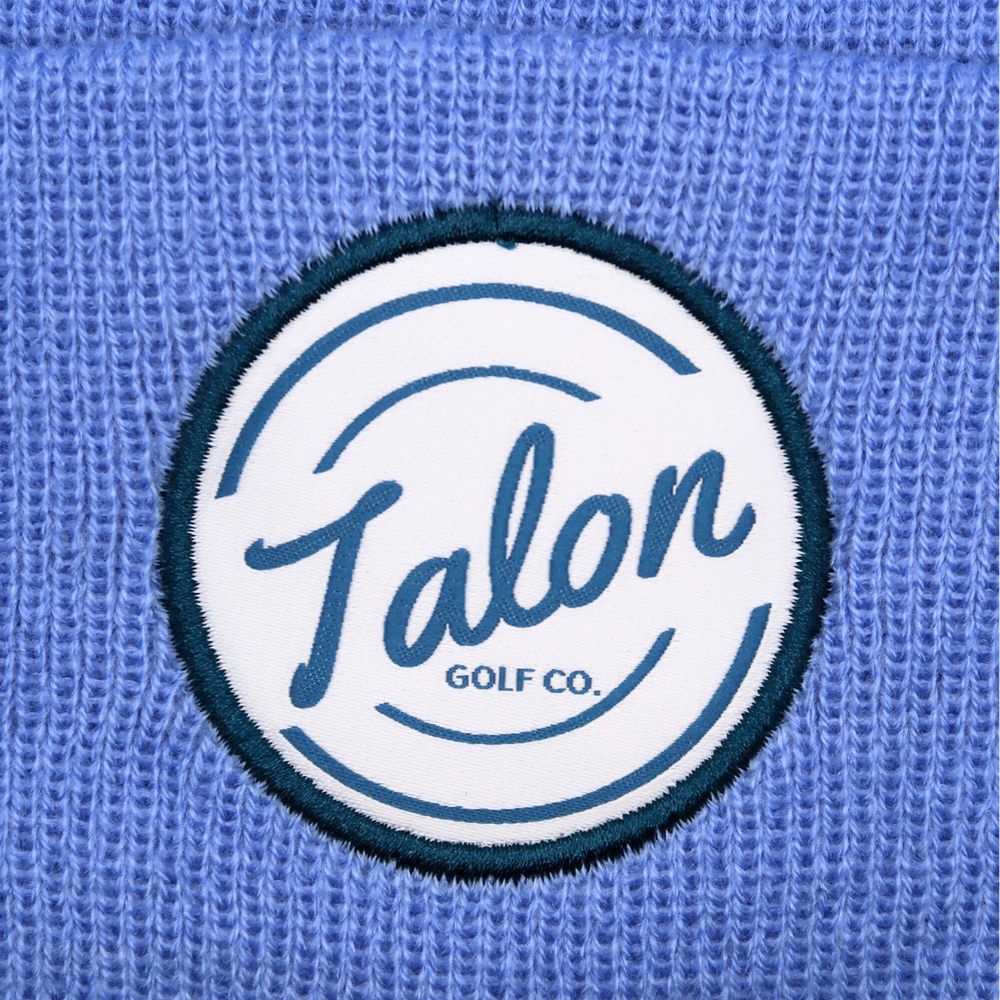 Blue Knit Beanie with White Talon Circle Logo Closeup.