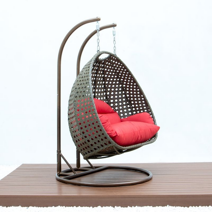 LeisureMod Beige Wicker Hanging 2 person Egg Swing Chair Red Photo.