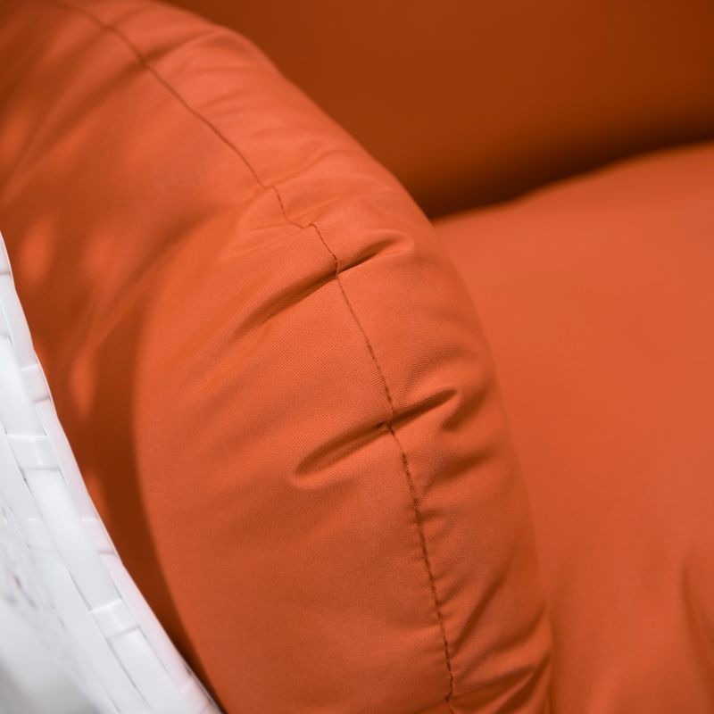 LeisureMod White Wicker Hanging Egg Swing Chair Orange Cushion Closeup.