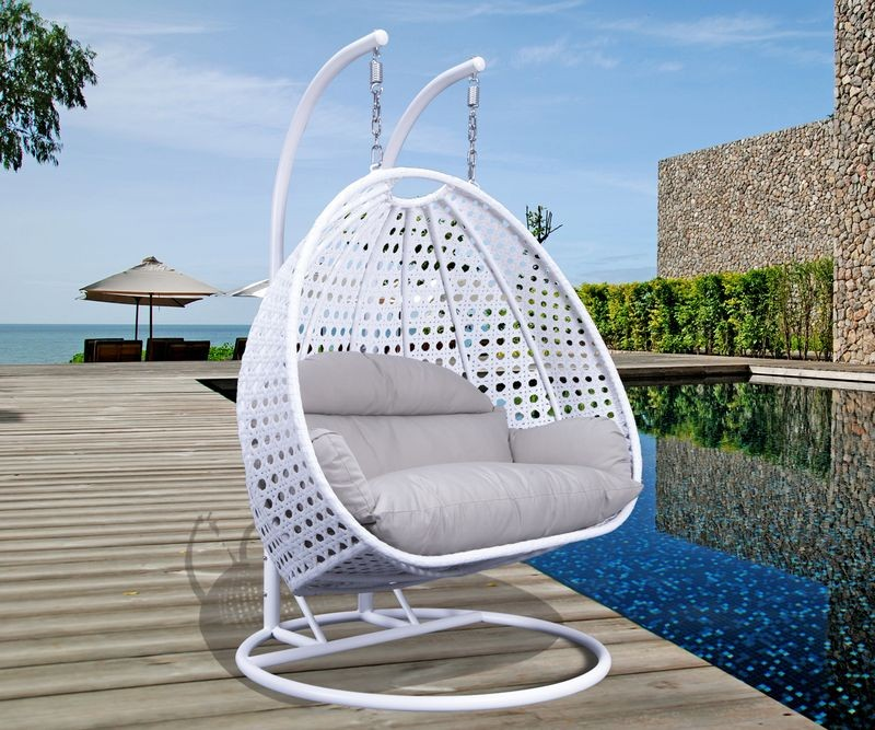 LeisureMod White Wicker Hanging 2 person Egg Swing Chair White/Taupe Photo.