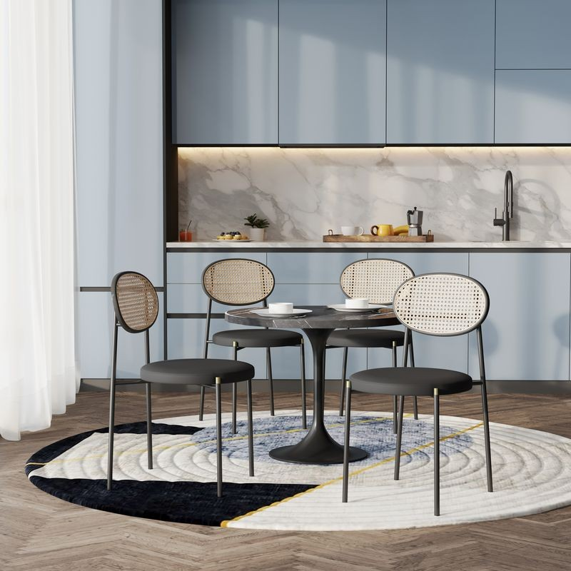 LeisureMod 5-Piece Dining Set with 36" Round Dining Table Black Sintered Stone Top and Black Pedestal with 4 Velvet Dining Chairs in Black Steel Legs in Black in Room.