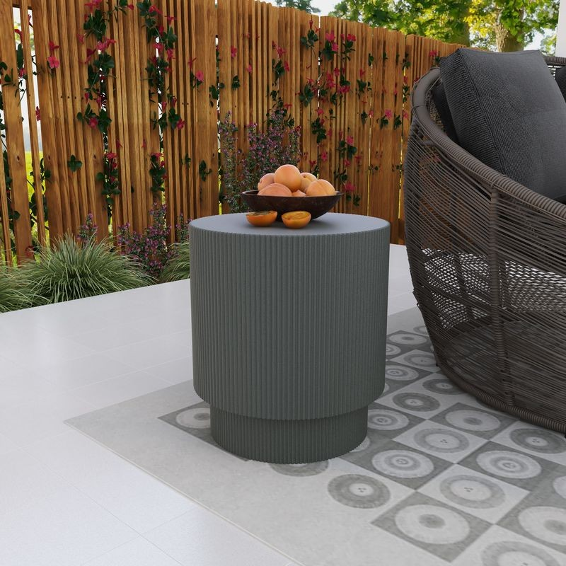 LeisureMod Eden Collection Fiberglass Outdoor Side Table in Grey on Patio.