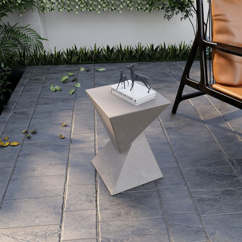 LeisureMod Glint Collection Fiberglass Outdoor Side Table in Marble White on Patio.