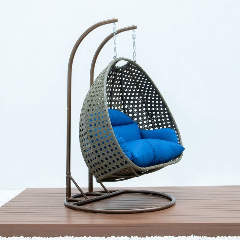 LeisureMod Beige Wicker Hanging 2 person Egg Swing Chair Blue Side View.