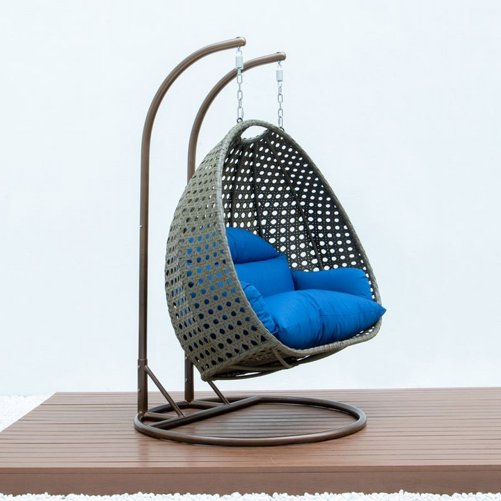 LeisureMod Beige Wicker Hanging 2 person Egg Swing Chair Blue Side View.