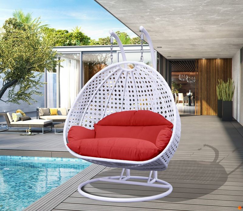 LeisureMod White Wicker Hanging 2 person Egg Swing Chair Red on Patio.