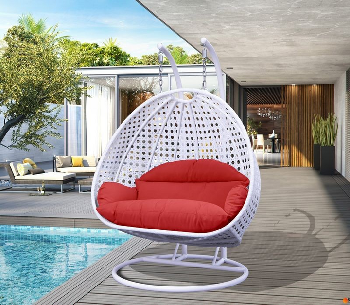 LeisureMod White Wicker Hanging 2 person Egg Swing Chair Red on Patio.