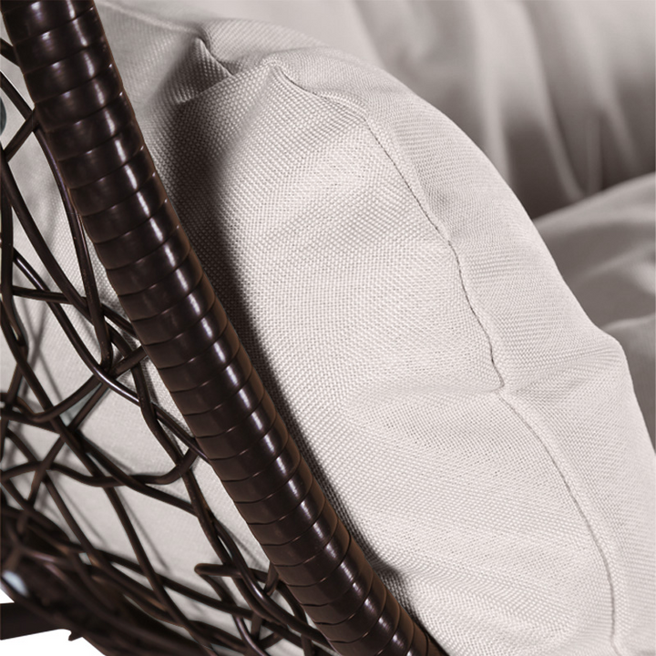 Leisuremod Recluse Collection Modern Outdoor Swing Chair Brown Frame with ES57 Beige Cushion Closeup.