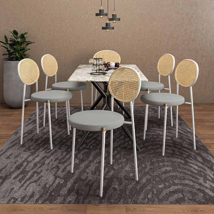 LeisureMod 7-Piece Dining Set with Rectangular Sintered Stone Dining Table and 6 Velvet Dining Side Chairs with Wicker Back Grey in Room.