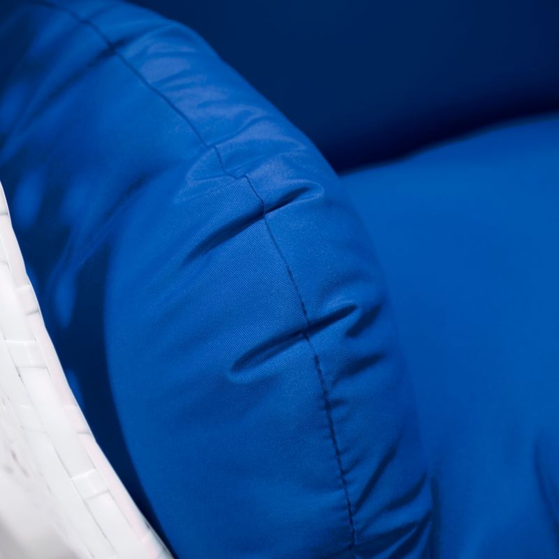 LeisureMod White Wicker Hanging Egg Swing Chair Blue Cushion Closeup.