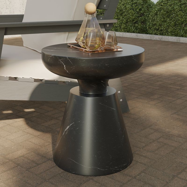 LeisureMod Isle Collection Fiberglass Outdoor Side Table in Marbled Black Outside.