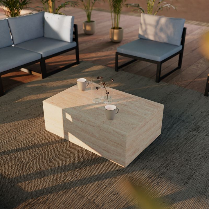 LeisureMod Maya Collection Outdoor/Indoor Coffee Table in Travertine Outside.