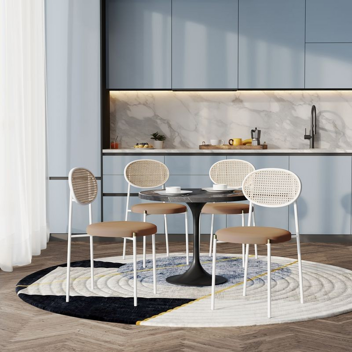 LeisureMod 5-Piece Dining Set with 36" Round Dining Table Black Sintered Stone Top and Black Pedestal with 4 Velvet Dining Chairs in White Steel Legs in Brown in Room.
