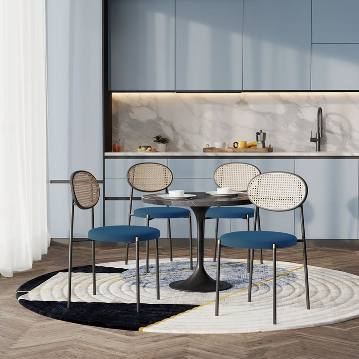 LeisureMod 5-Piece Dining Set with 36" Round Dining Table Black Sintered Stone Top and Black Pedestal with 4 Velvet Dining Chairs in Black Steel Legs in Navy Blue in Room.