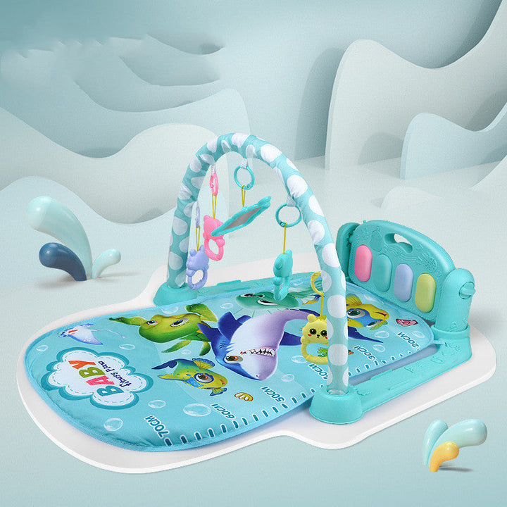 Baby play mat with shark design on a light blue background.