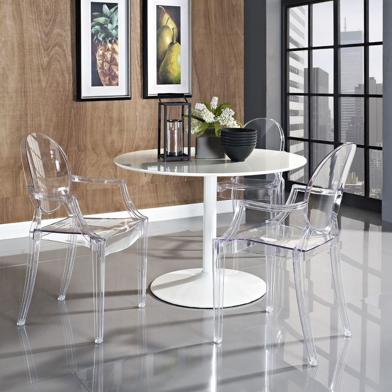 LeisureMod Carroll Modern Acrylic Dining Side Chairs Around a Table.