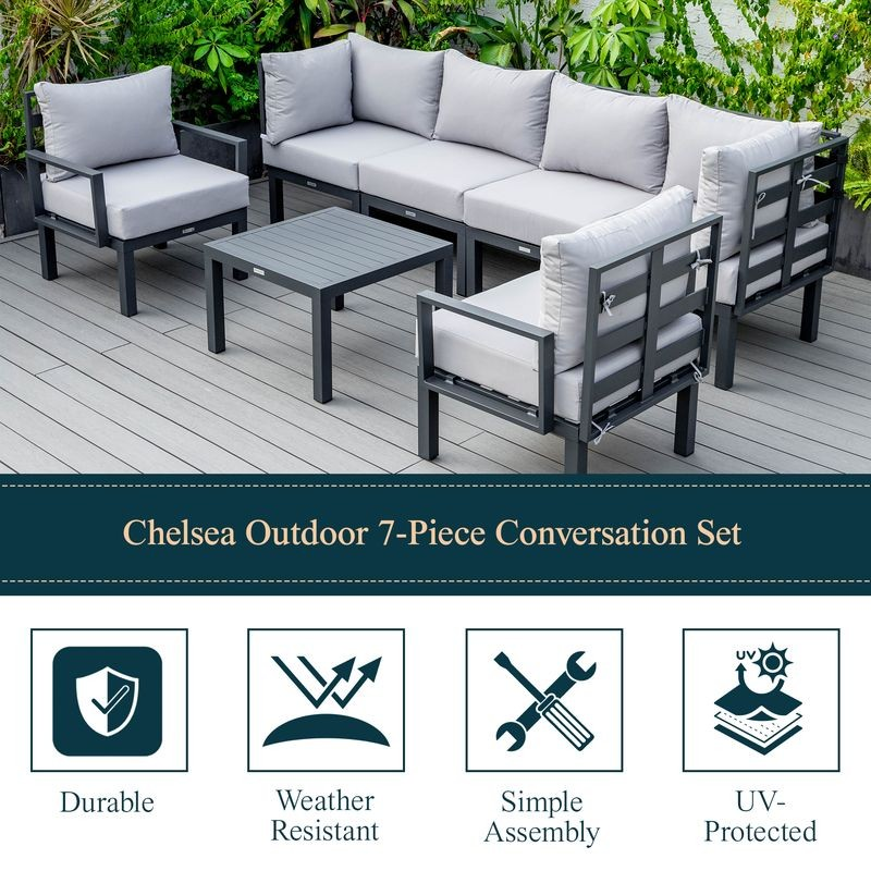 LeisureMod Chelsea 7-Piece Patio Sectional and Coffee Table Set Black Aluminum with Cushions Light Grey Details.