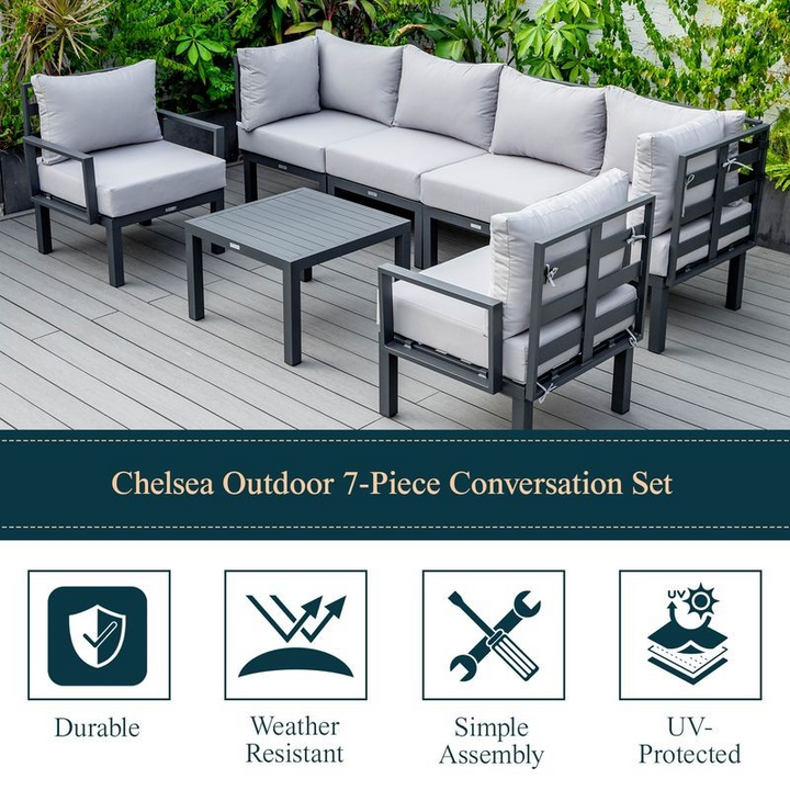 LeisureMod Chelsea 7-Piece Patio Sectional and Coffee Table Set Black Aluminum with Cushions Light Grey Details.