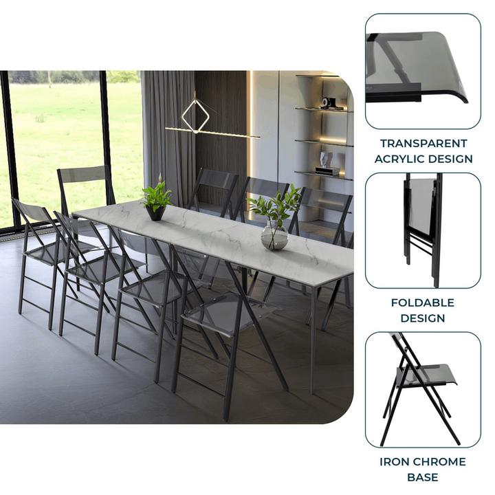 Dining area with long white table and black chairs, featuring transparent acrylic design and iron chrome base.