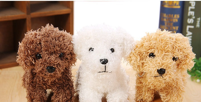 Three plush toy dogs in brown, white, and beige sitting together on a surface.