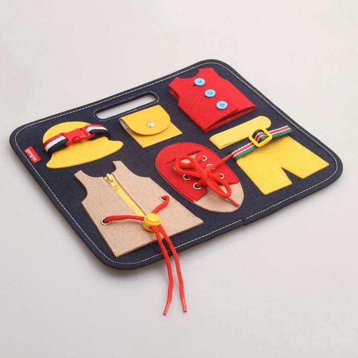 Colorful felt play set with various clothing items on a gray background.