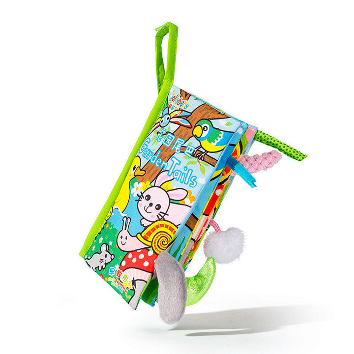 Colorful children's book with soft toys on a white background.