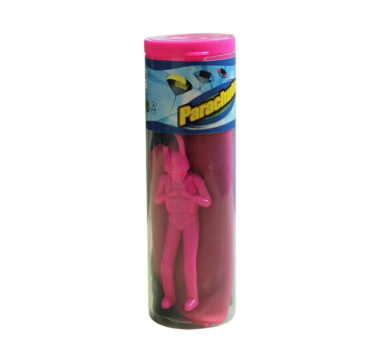 Pink plastic figure in a parachute brand packaging on a white background.