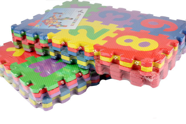 Colorful foam puzzle mats with letters and numbers on a white background.