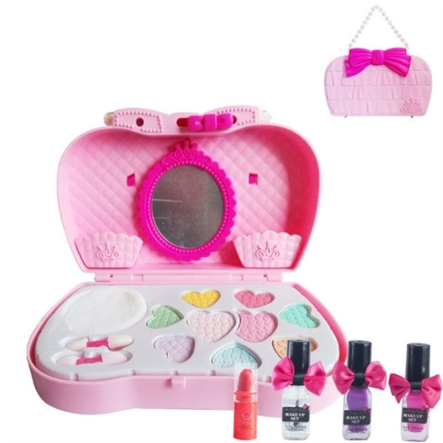 Pink toy makeup set with mirror, bottles, and lipsticks on a white background.