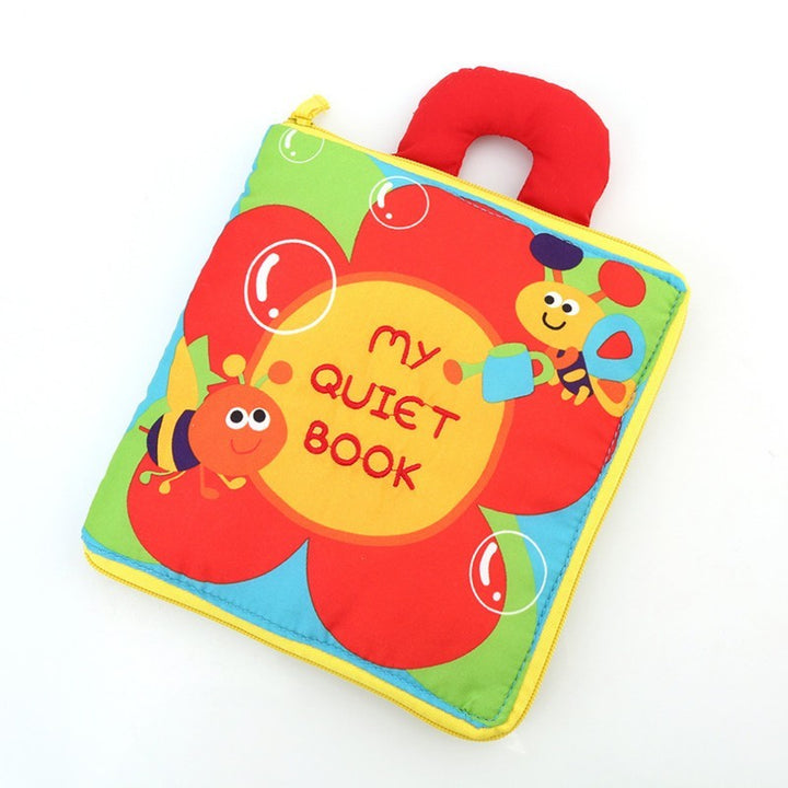 Colorful children's book with a red handle on a white background.