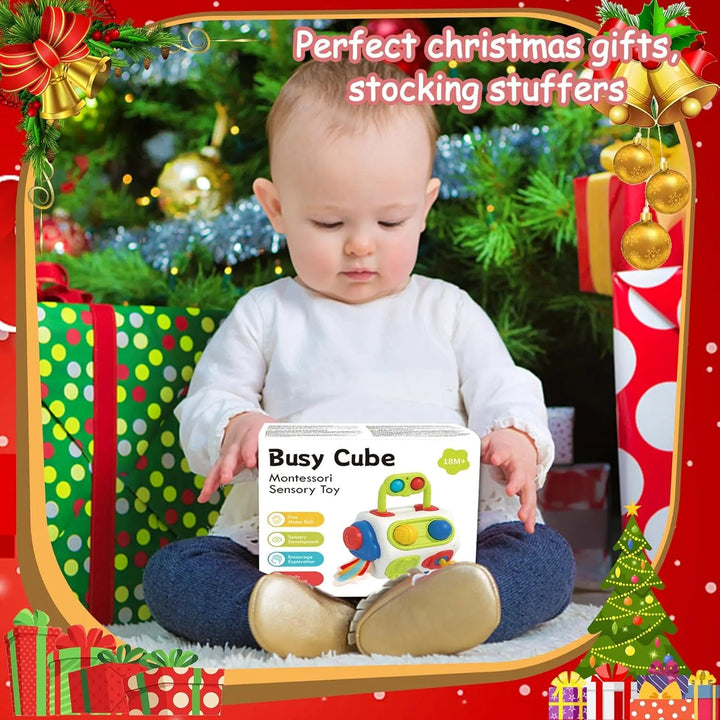Child holding a Busy Cube toy with Christmas decorations in the background.