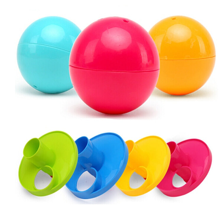 Colorful plastic balls with attached nozzles on a white background.