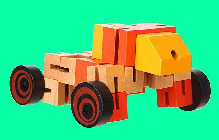 Toy truck made of interlocking blocks on a green background.