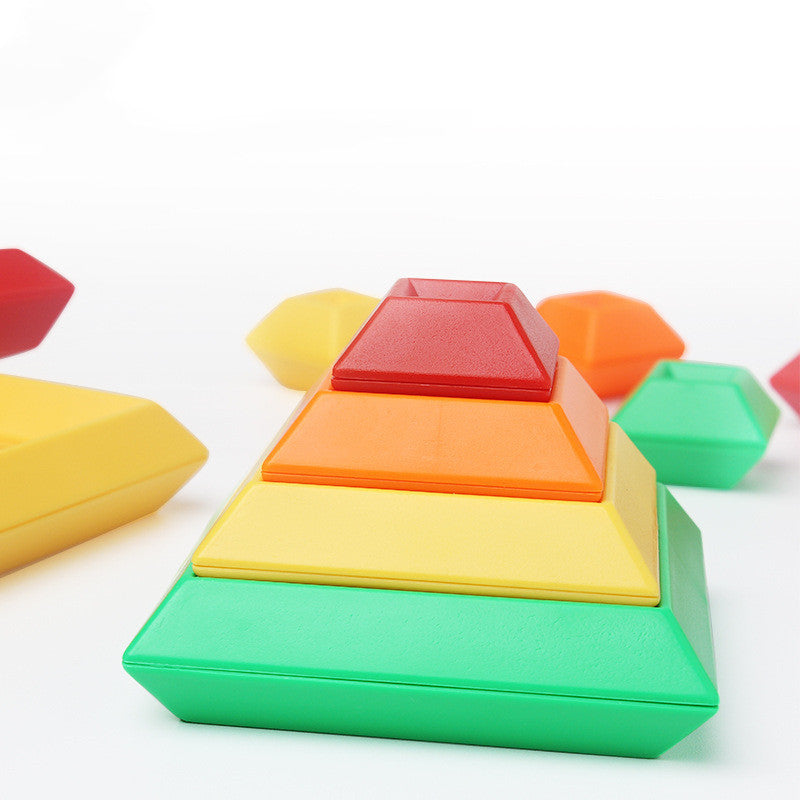 Colorful pyramid-shaped building blocks on a white background.