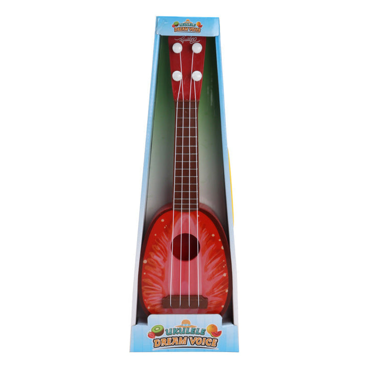 Red toy ukulele in packaging with dream voice branding on a white background.
