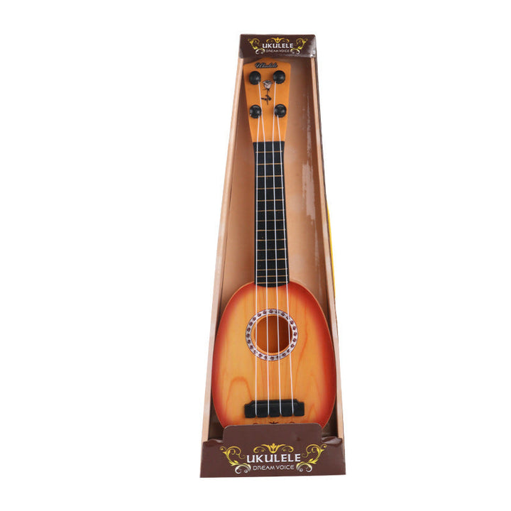 Ukulele in packaging on a white background.