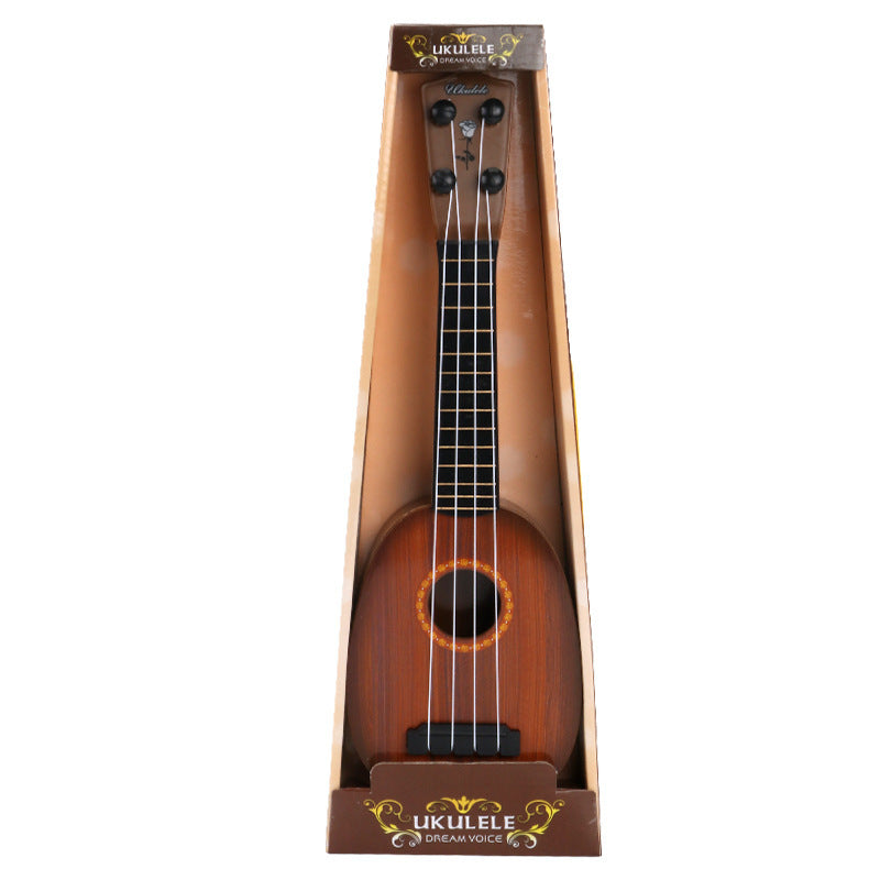Wooden ukulele in packaging on a white background.