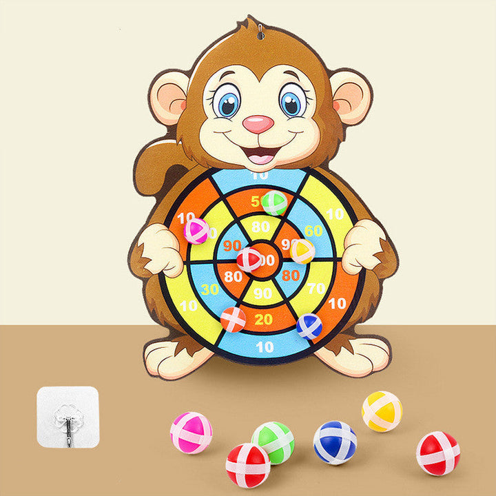 Children's dartboard with monkey design on a beige background.