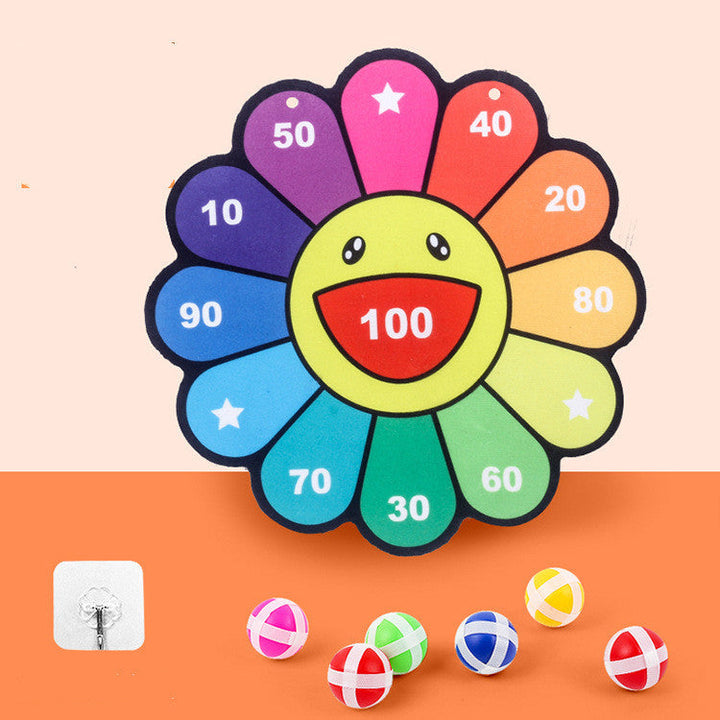 Colorful target game with numbers and balls on a peach and orange background.