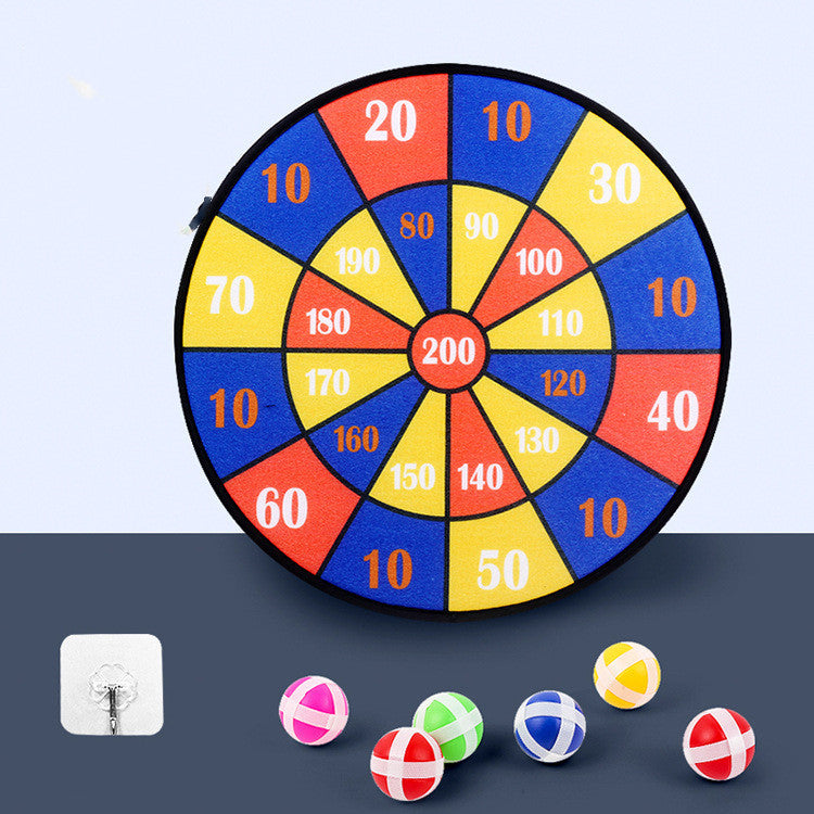 Colorful dartboard with numbered sections and darts on a dark surface.