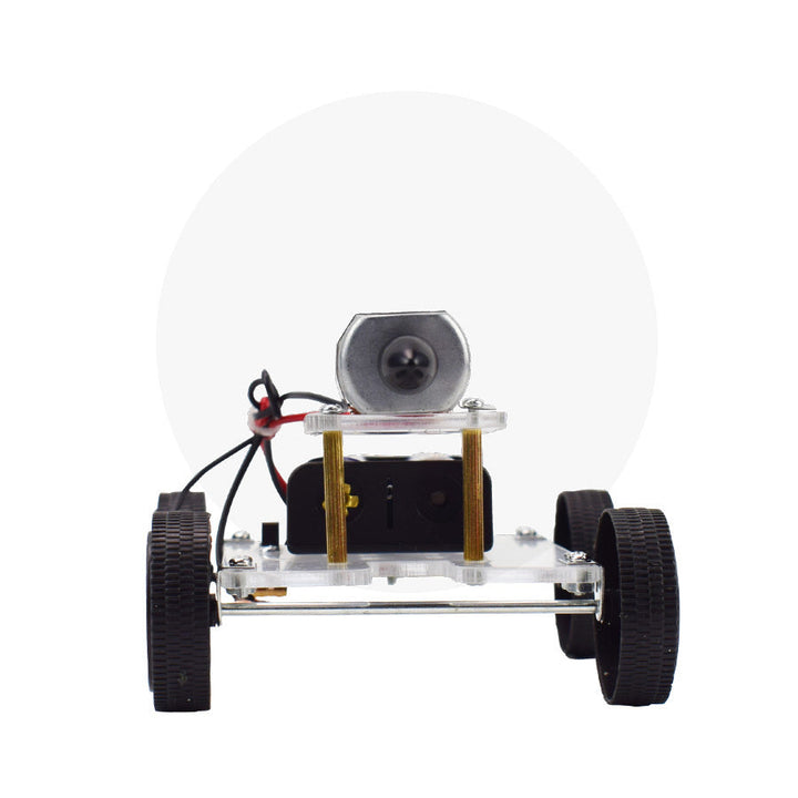 Small vehicle chassis with wheels and electronic components on a white background.