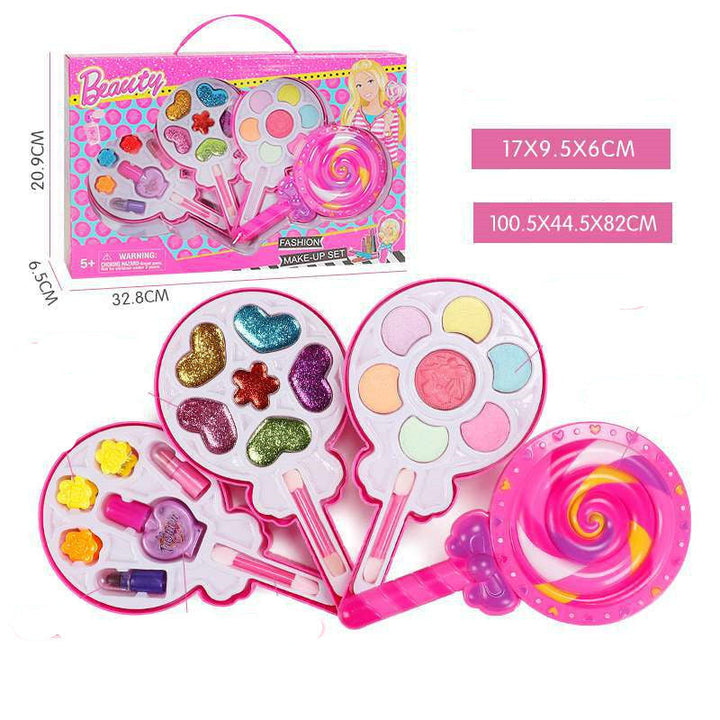 Toy makeup set with packaging, including palettes and applicators, on a white background.