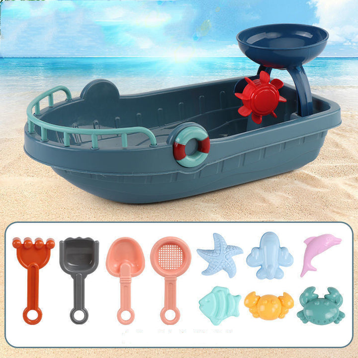Toy boat with sand toys on a beach background.
