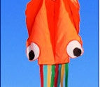 Colorful kite shaped like an octopus on a blue background.