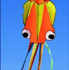 Colorful kite shaped like an octopus against a clear blue sky.